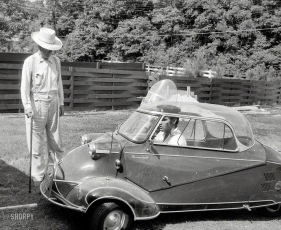 Elvis in a mini car. 1957.